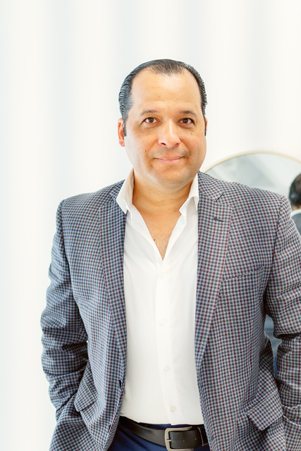 Randolf Arias standing in a bright interior